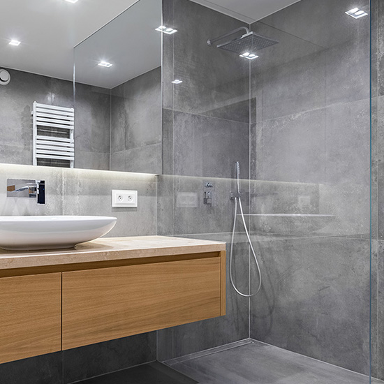 gleaming glass, tile, and bathroom fixtures