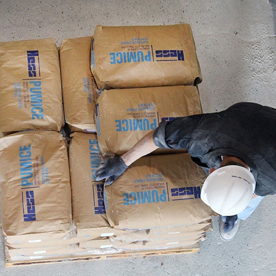 loading pumice bags on a pallet
